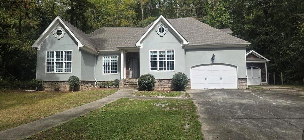 4119 Waits Avenue Southwest Atlanta, GA 30331 - Photo 1 of 15 a front view of a house with a yard
