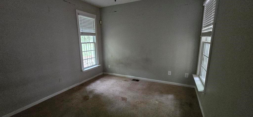 4119 Waits Avenue Southwest Atlanta, GA 30331 - Photo 11 of 15 an empty room with windows