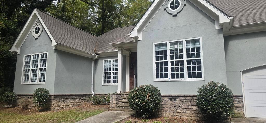 4119 Waits Avenue Southwest Atlanta, GA 30331 - Photo 13 of 15 a front view of a house with a yard
