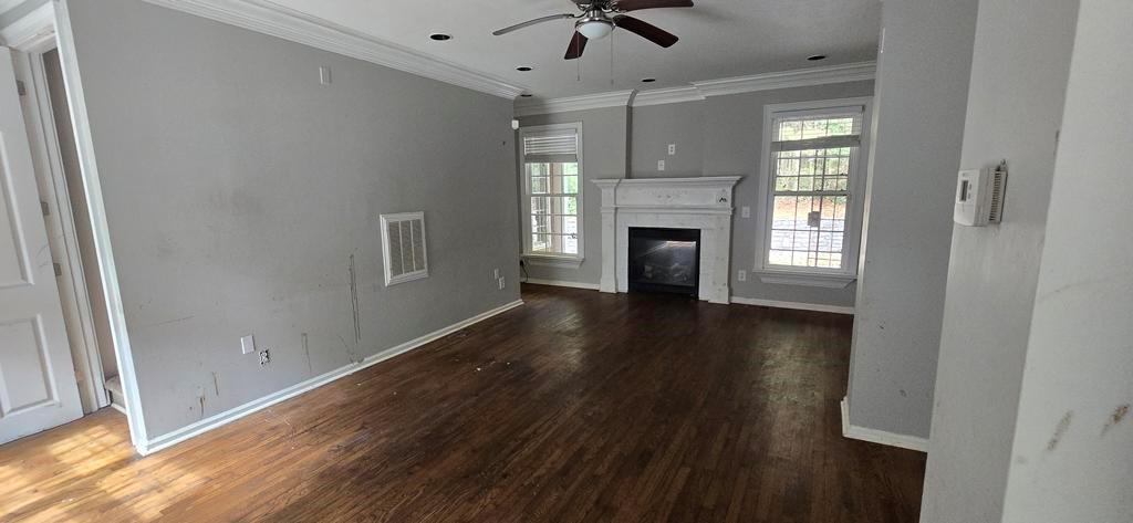 4119 Waits Avenue Southwest Atlanta, GA 30331 - Photo 2 of 15 a view of an empty room with a fireplace and a window