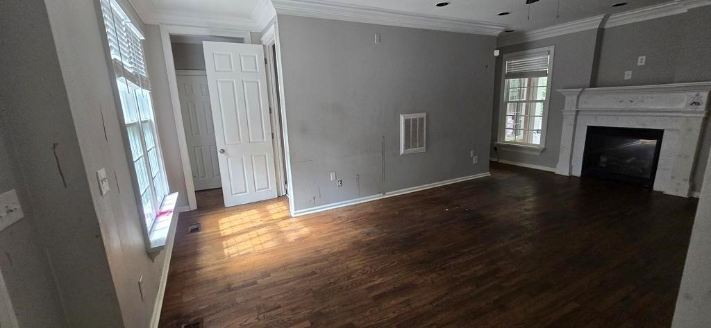 4119 Waits Avenue Southwest Atlanta, GA 30331 - Photo 3 of 15 a view of livingroom with hardwood floor and a fireplace