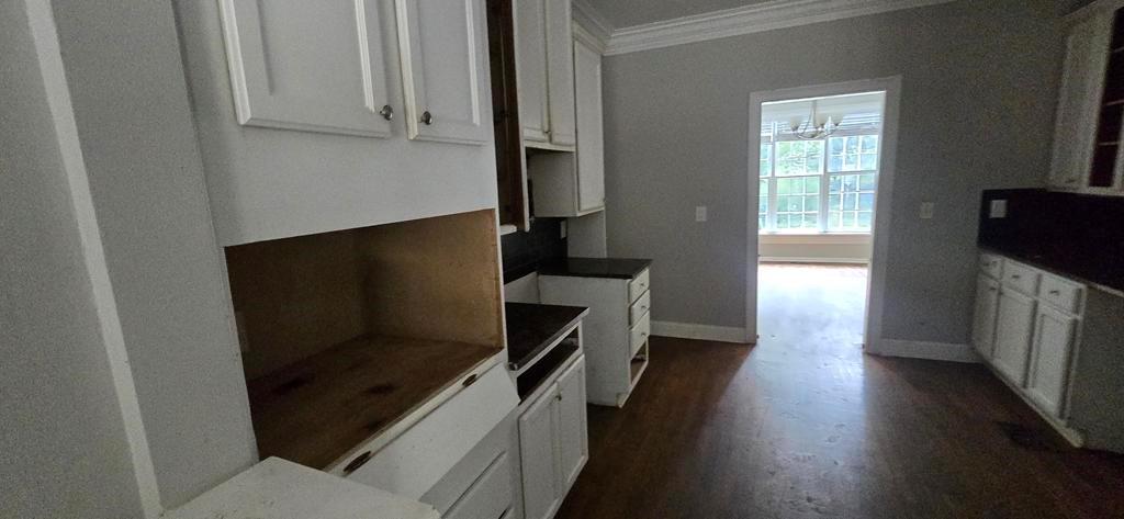 4119 Waits Avenue Southwest Atlanta, GA 30331 - Photo 5 of 15 a kitchen with wooden cabinets and a stove