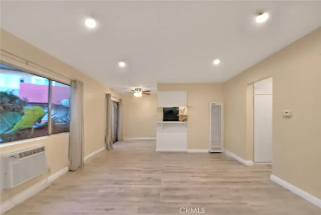 a view of a living room and kitchen with furniture