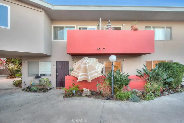 a view of a balcony with iron fence