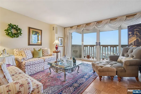 a living room with furniture and a large window
