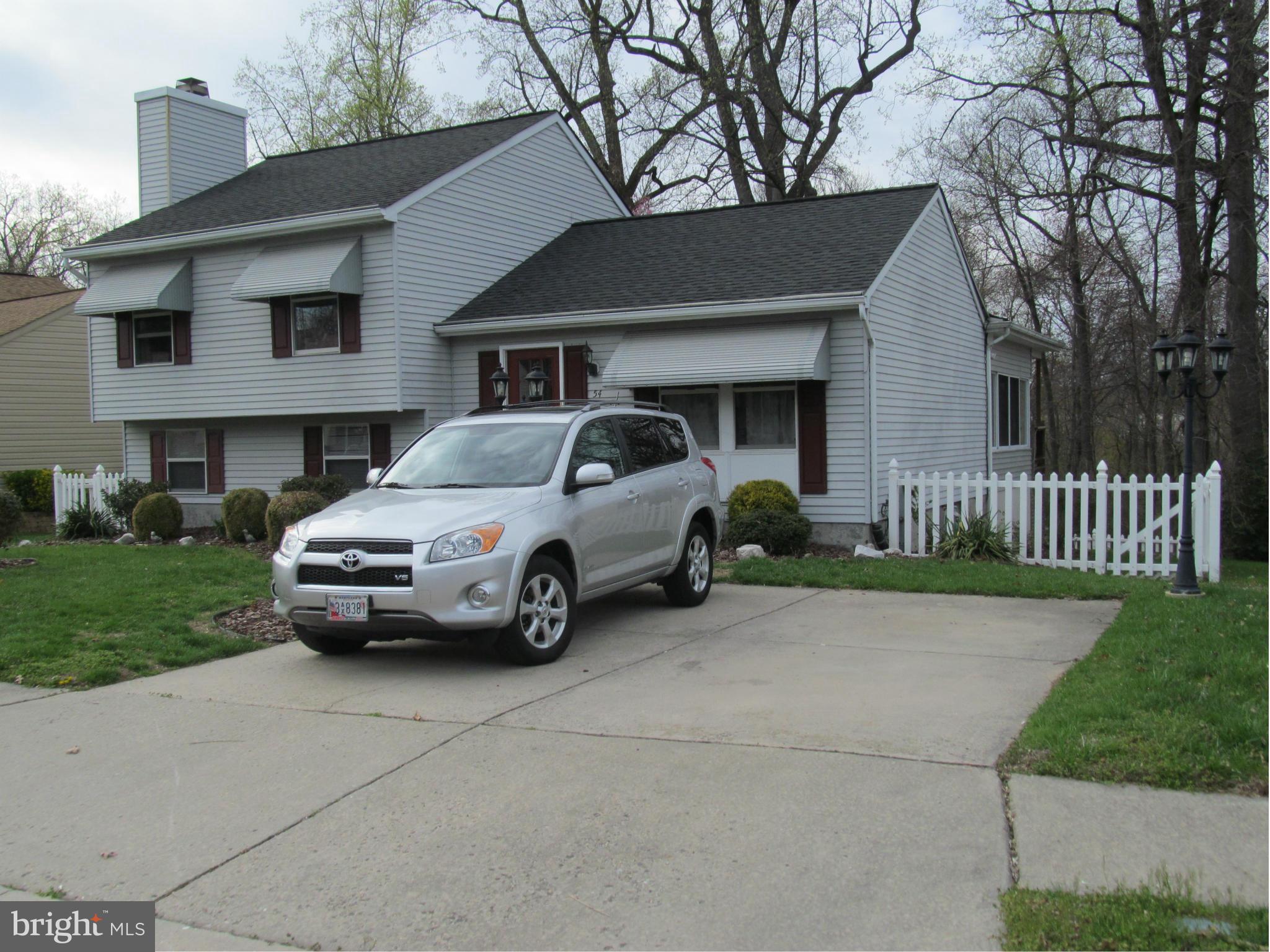 54 Yew Road Baltimore, MD 21221 - Photo 2 of 28 a house view with a garden space