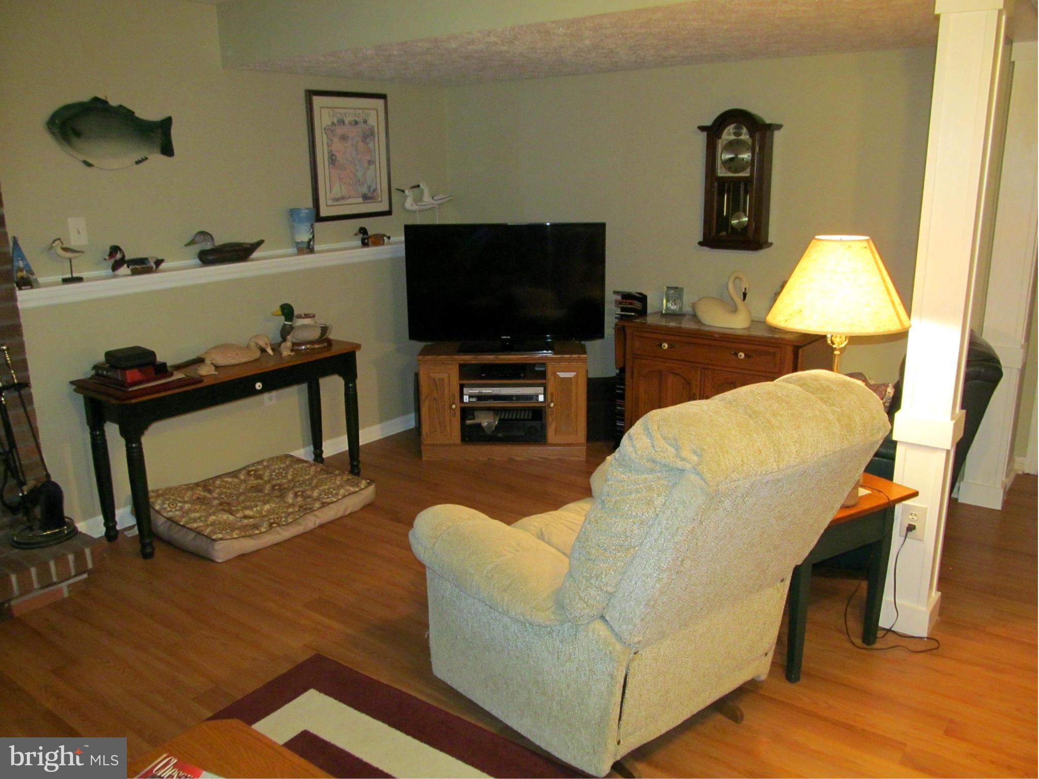 54 Yew Road Baltimore, MD 21221 - Photo 12 of 28 a living room with furniture and a flat screen tv