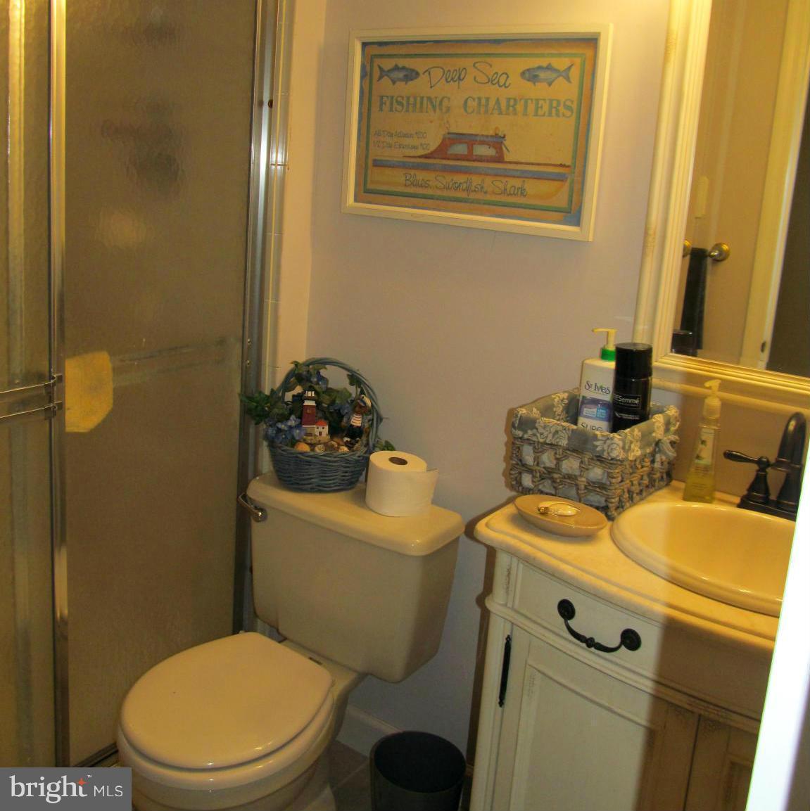 54 Yew Road Baltimore, MD 21221 - Photo 16 of 28 a bathroom with a toilet and a sink