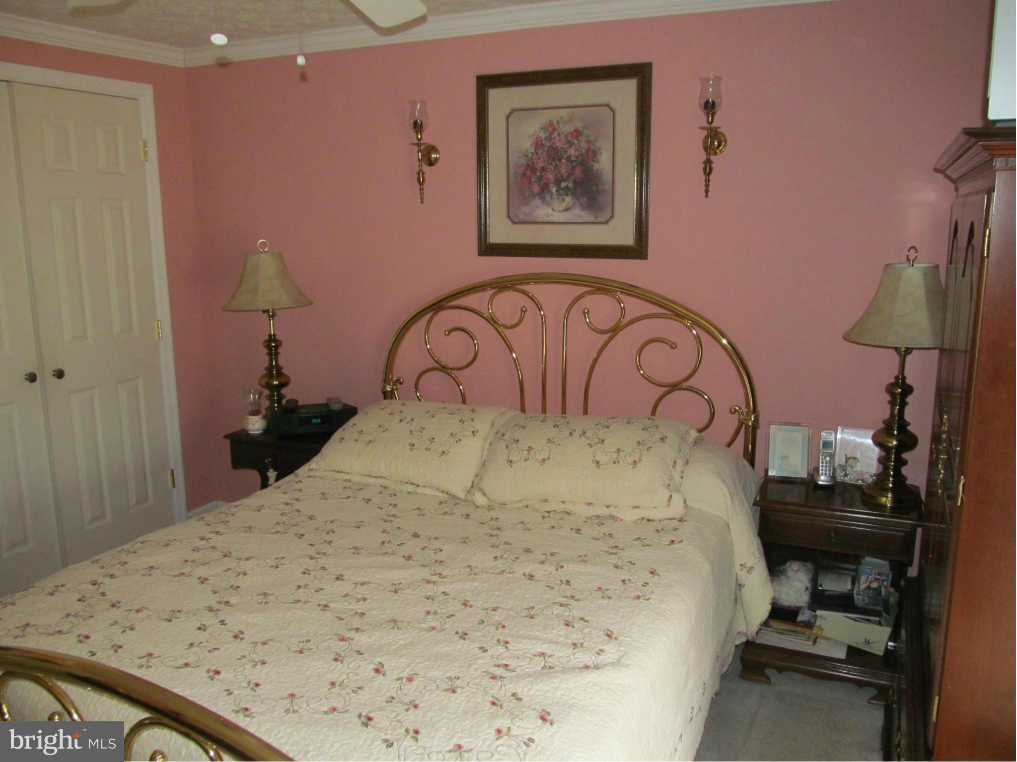 54 Yew Road Baltimore, MD 21221 - Photo 22 of 28 a bed with a bed and a table in it