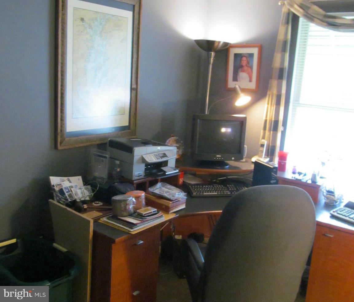 54 Yew Road Baltimore, MD 21221 - Photo 24 of 28 a living room with furniture and a mirror