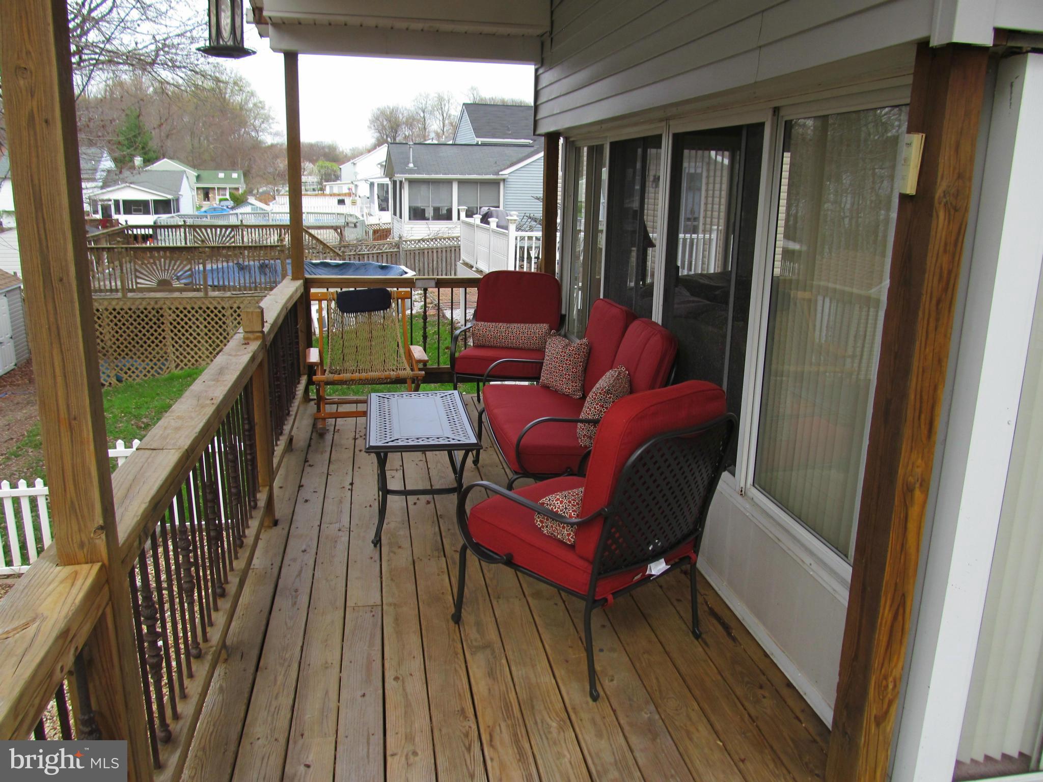 54 Yew Road Baltimore, MD 21221 - Photo 26 of 28 a balcony with furniture and wooden floor