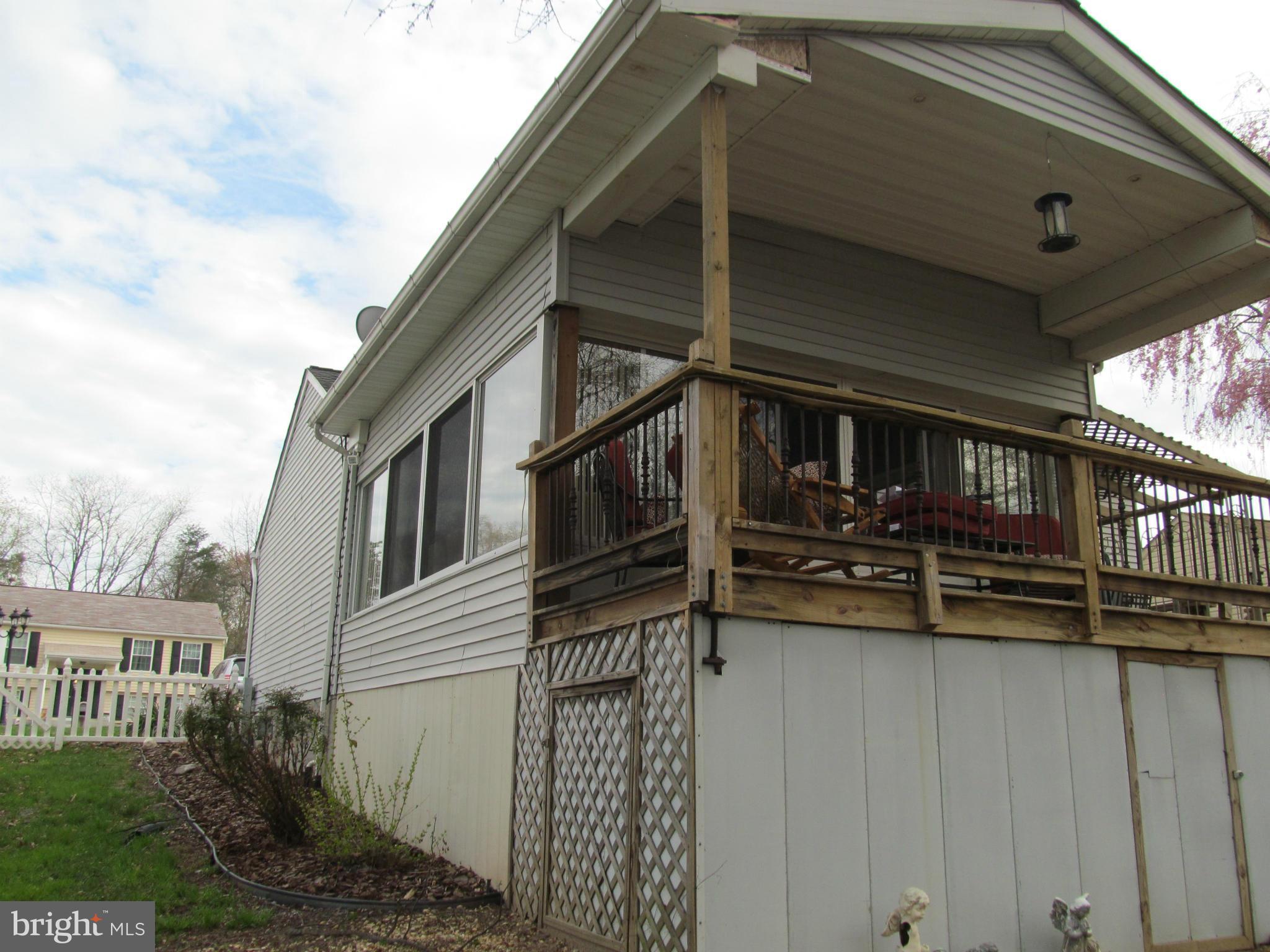 54 Yew Road Baltimore, MD 21221 - Photo 27 of 28 a view of a house with a balcony