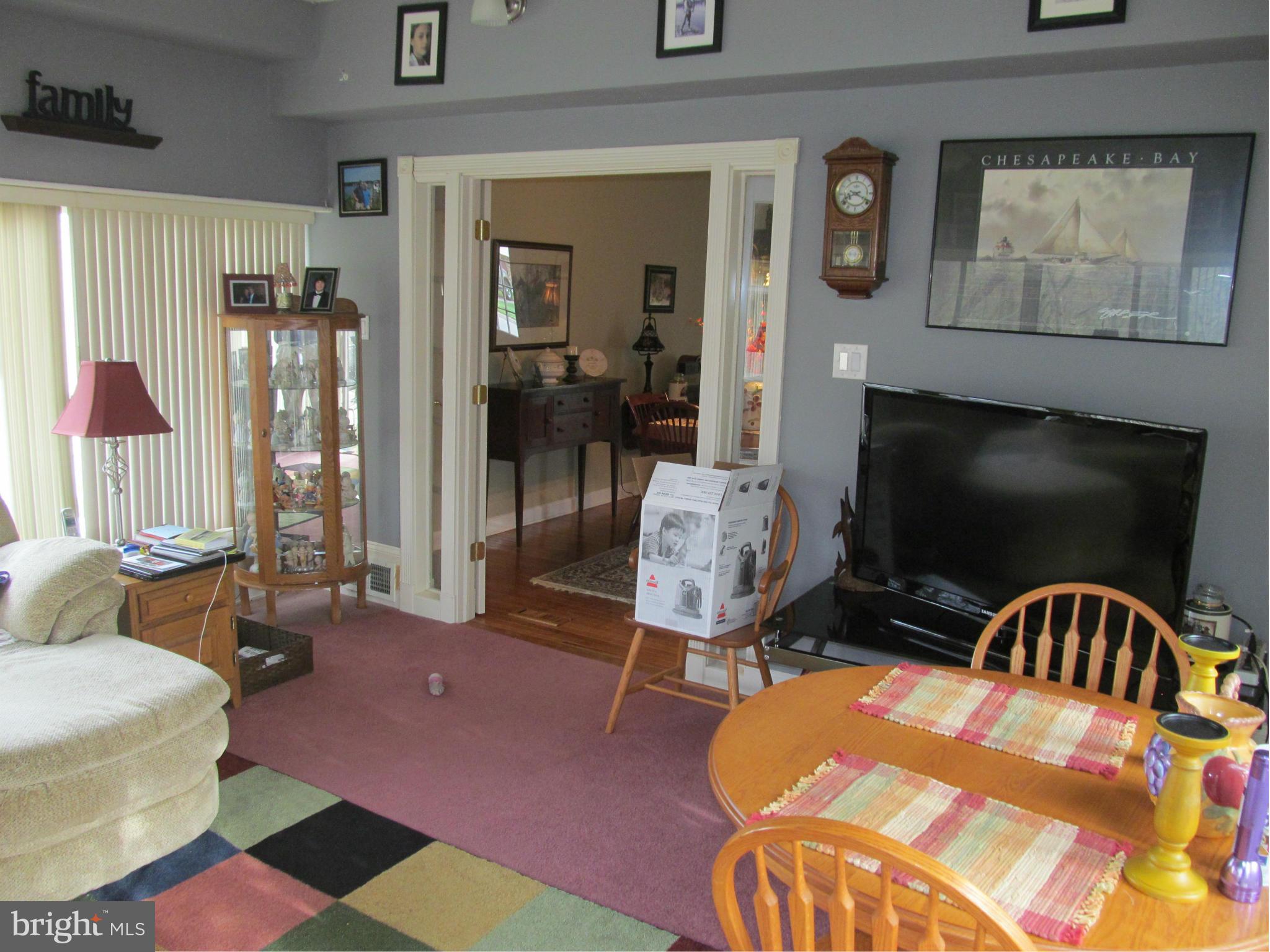 54 Yew Road Baltimore, MD 21221 - Photo 7 of 28 a bedroom with a bed and wooden floor