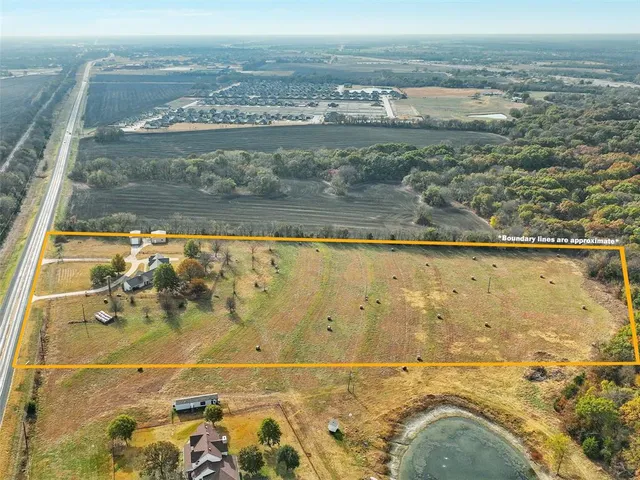 an aerial view of residential building and ocean