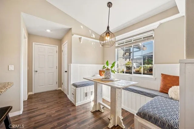 a spacious bedroom with a bed and a flat screen tv