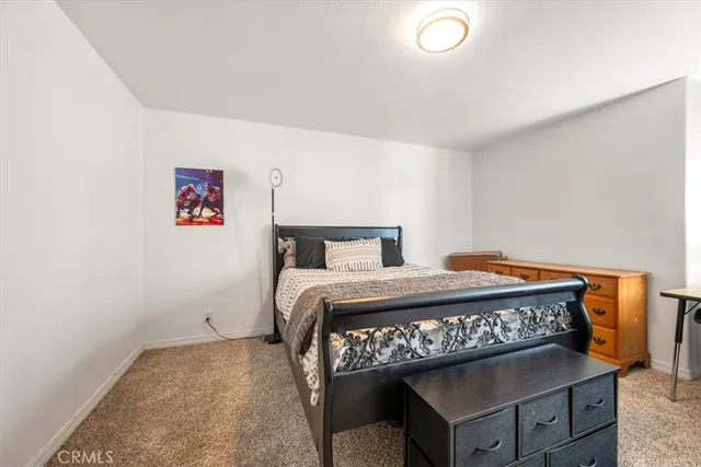 a bedroom with a bed and a table