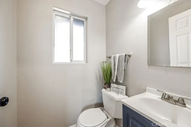 a bedroom with a bed wooden floor and table