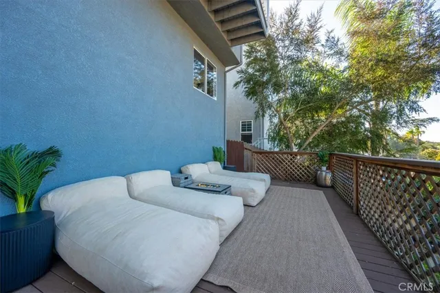 a view of a two chairs in the patio