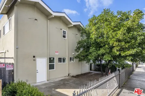 a view of a house with a tree
