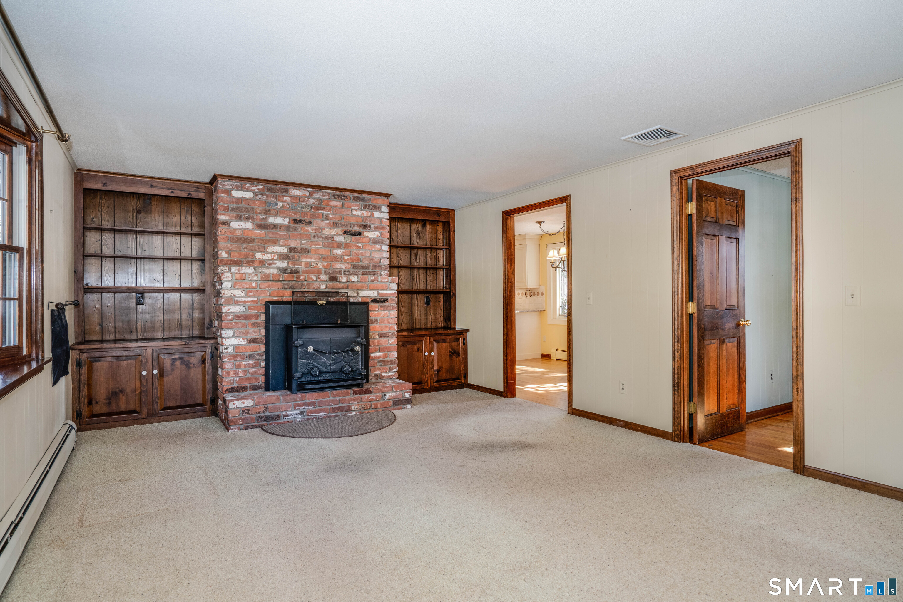 29 Long View Drive Simsbury, CT 06070 - Photo 15 of 41 an empty room with furniture and a fireplace