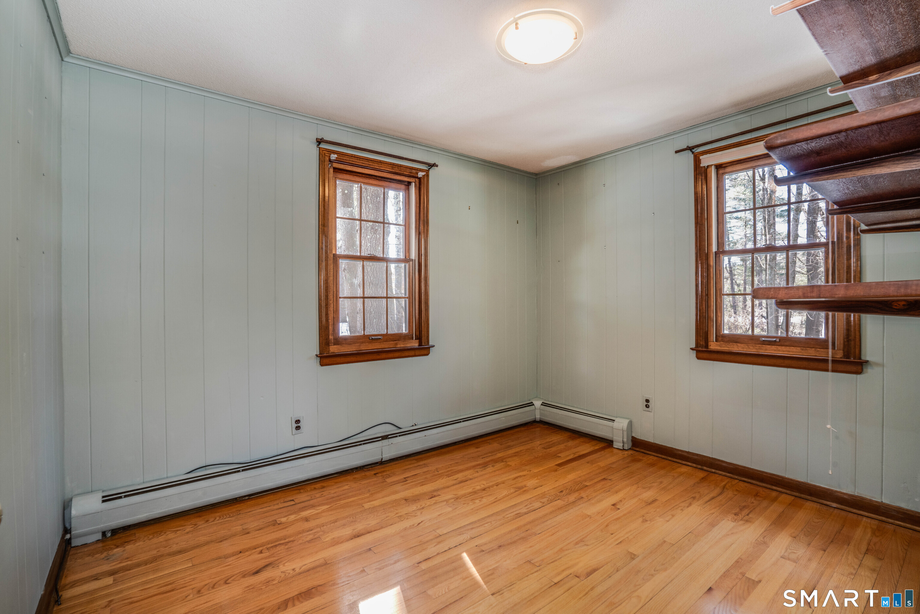 29 Long View Drive Simsbury, CT 06070 - Photo 17 of 41 a view of empty room with wooden floor and fan