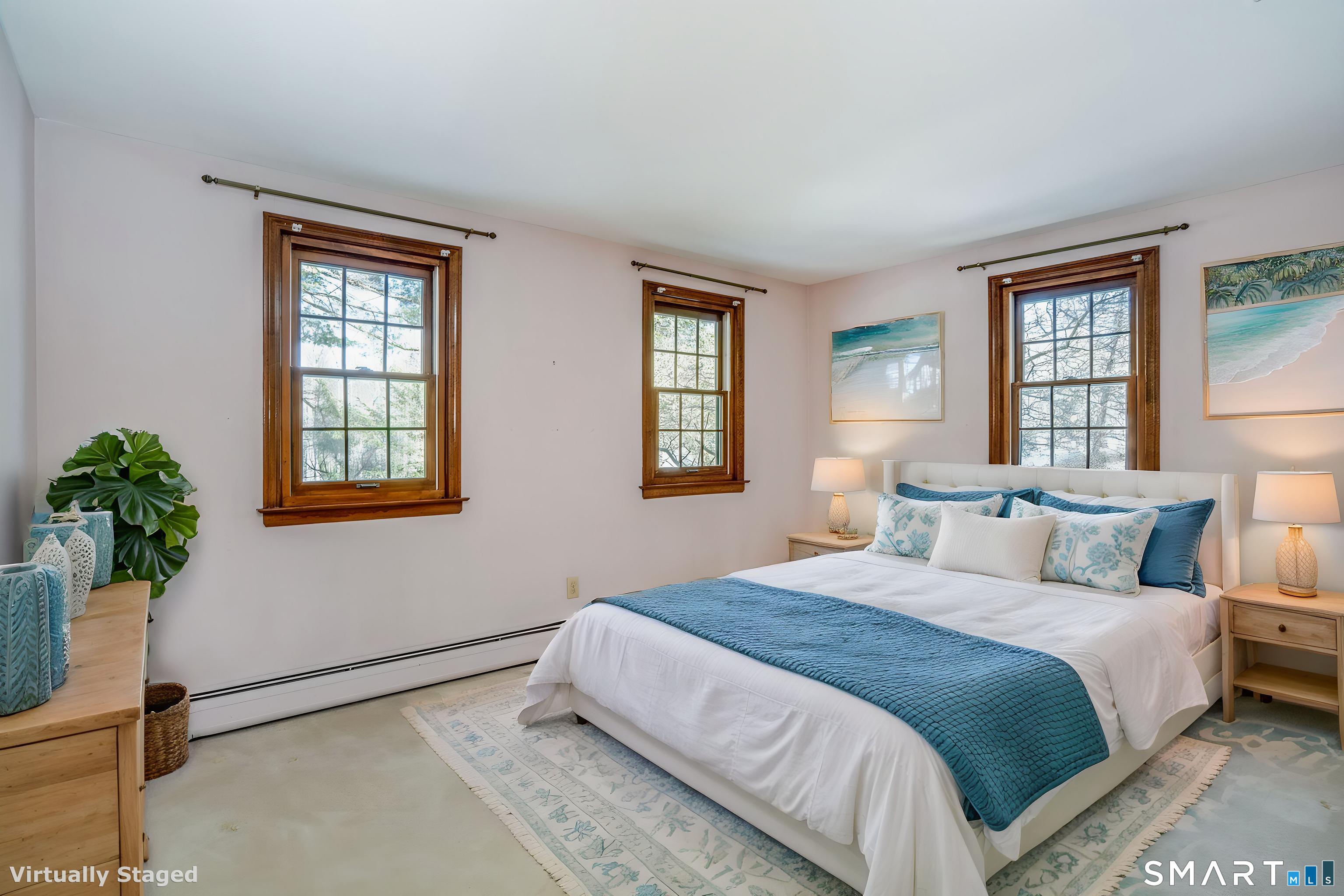 29 Long View Drive Simsbury, CT 06070 - Photo 26 of 41 a bedroom with a bed and a potted plant