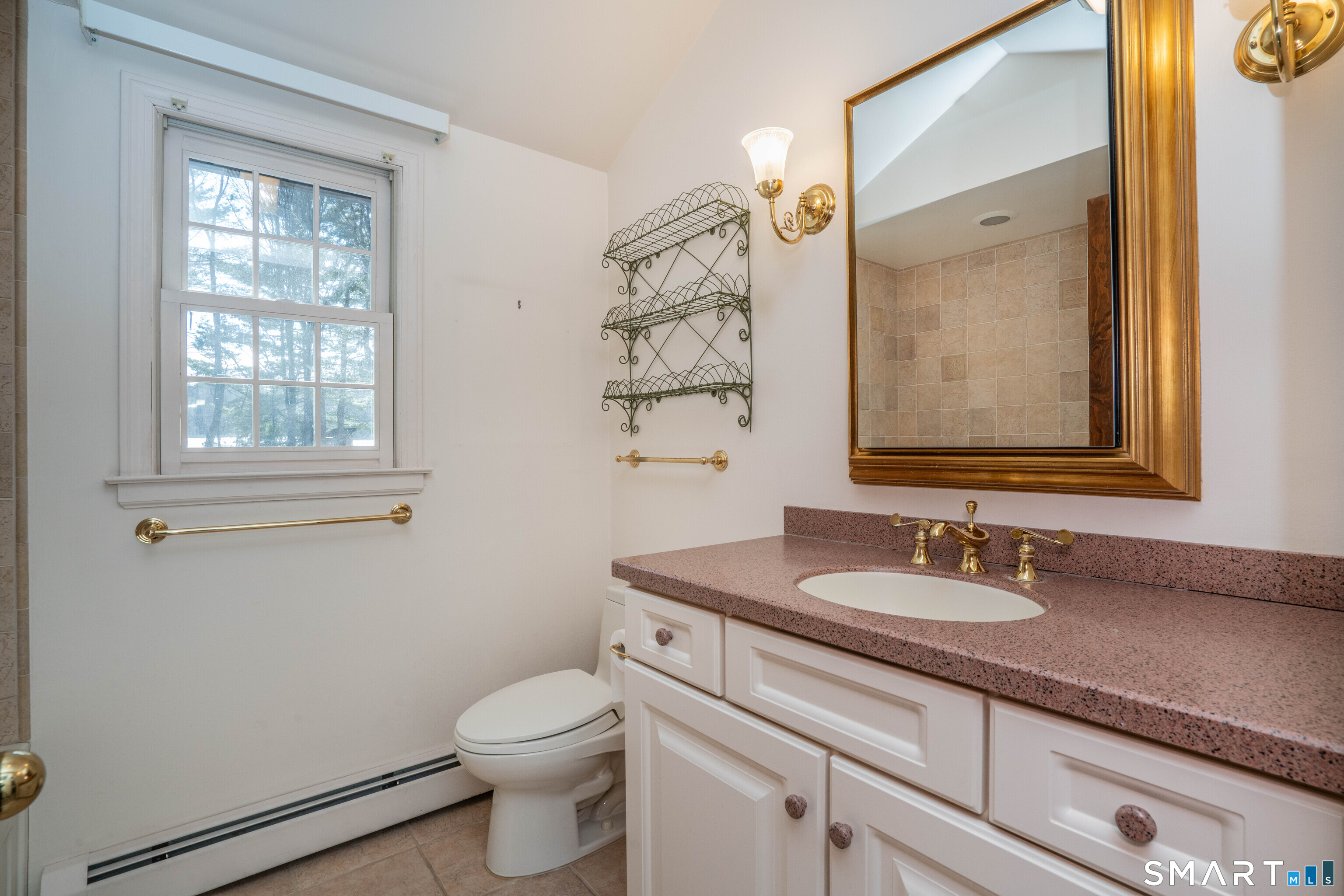 29 Long View Drive Simsbury, CT 06070 - Photo 31 of 41 a bathroom with a granite countertop toilet sink and mirror