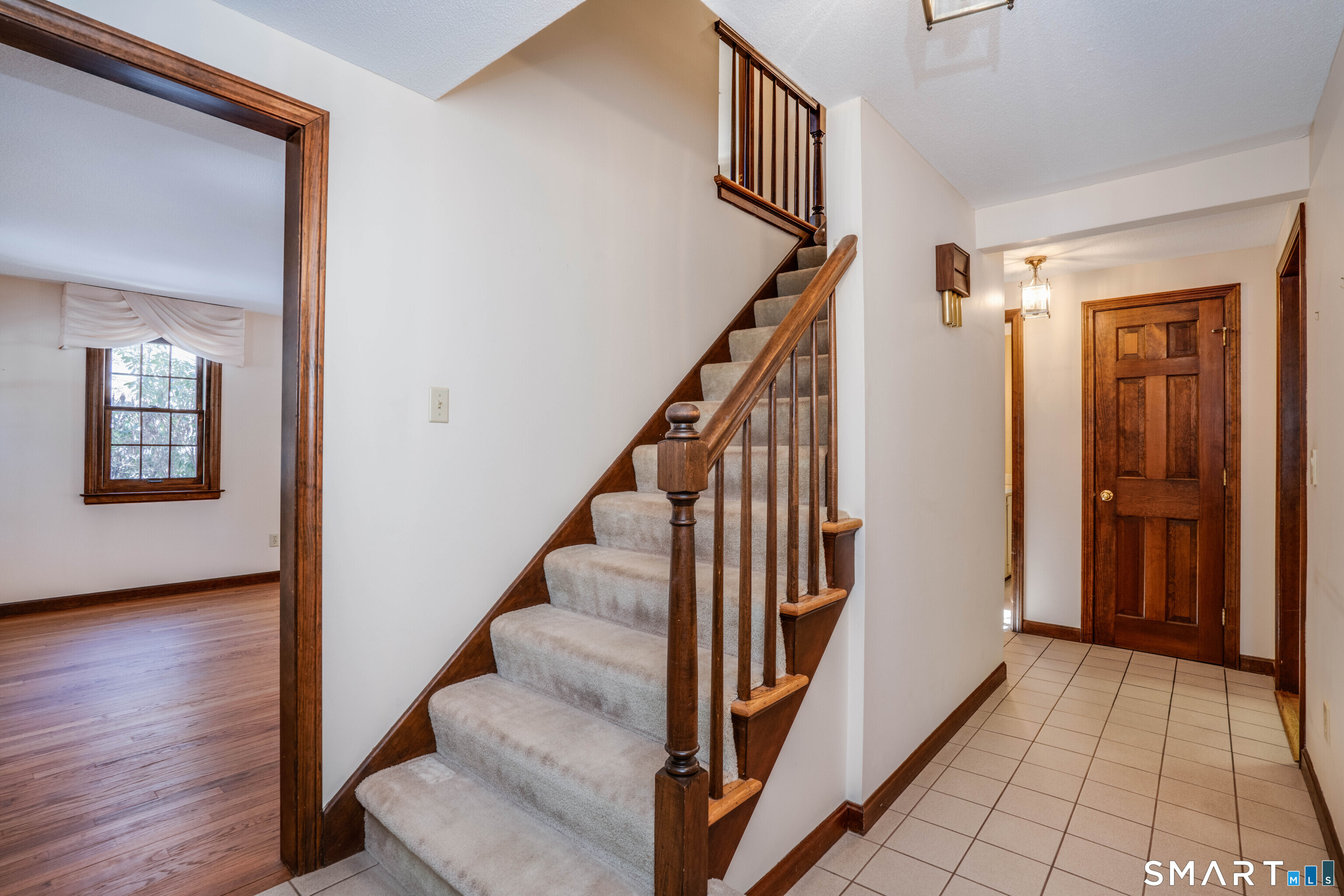 29 Long View Drive Simsbury, CT 06070 - Photo 4 of 41 a view of a hallway with wooden floor and staircase