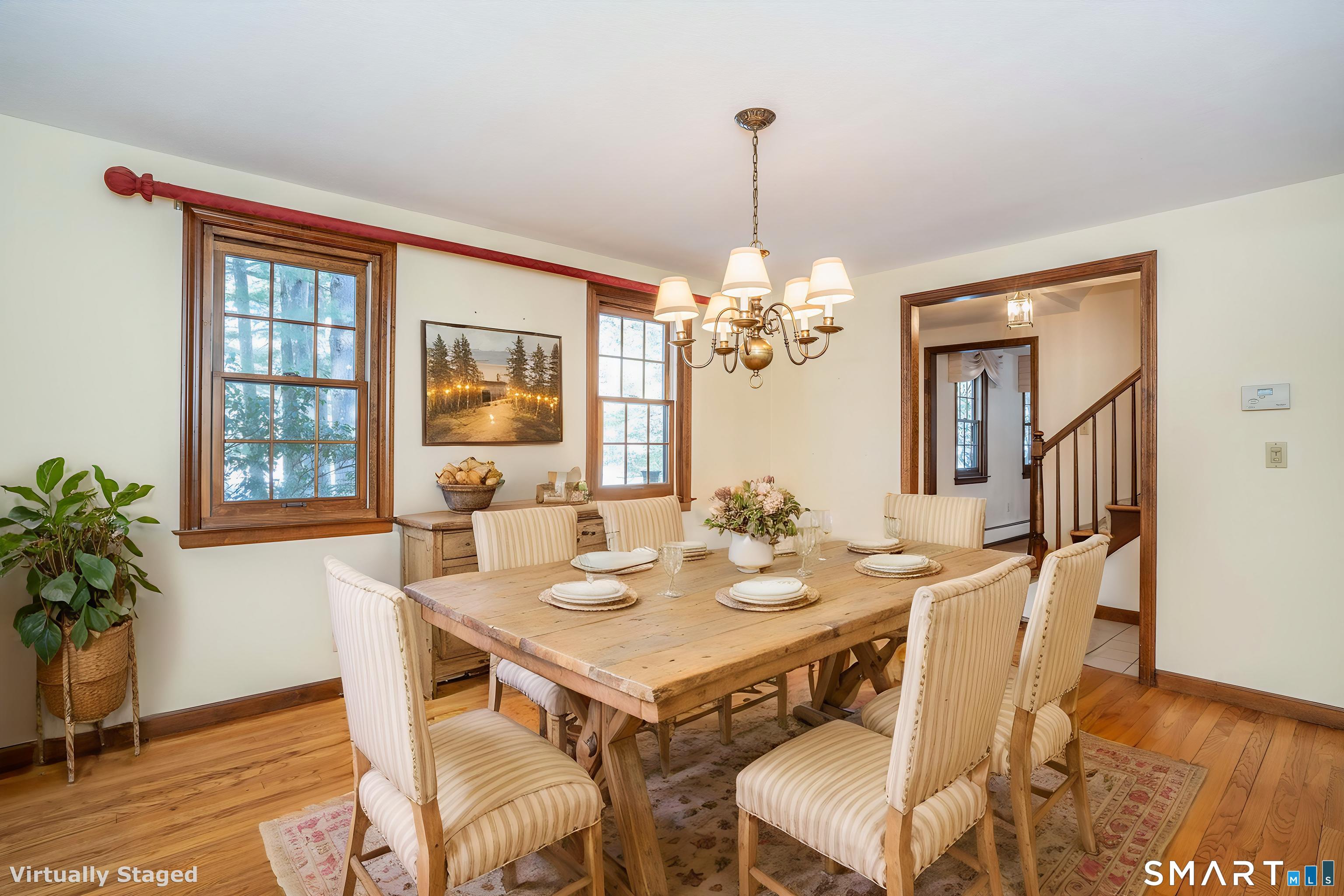 29 Long View Drive Simsbury, CT 06070 - Photo 7 of 41 a view of a dining room with furniture window and wooden floor