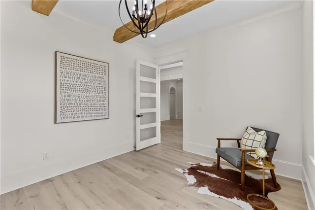 a kitchen with stainless steel appliances granite countertop a kitchen island hardwood floor sink and stove