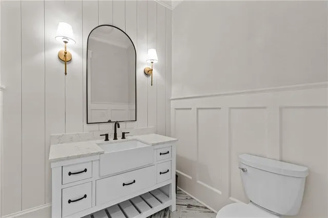 a view of a lake with a yard and large trees