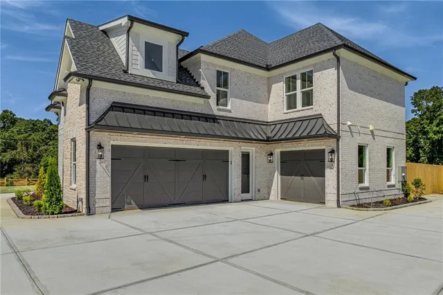 a view of a hallway view with wooden floor and staircase