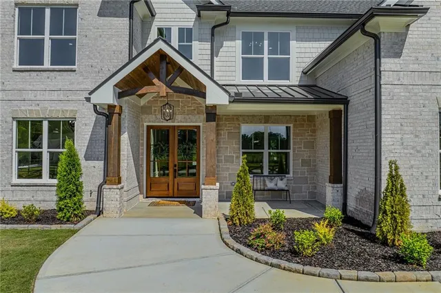 a view of a room with window wooden floor and glass door