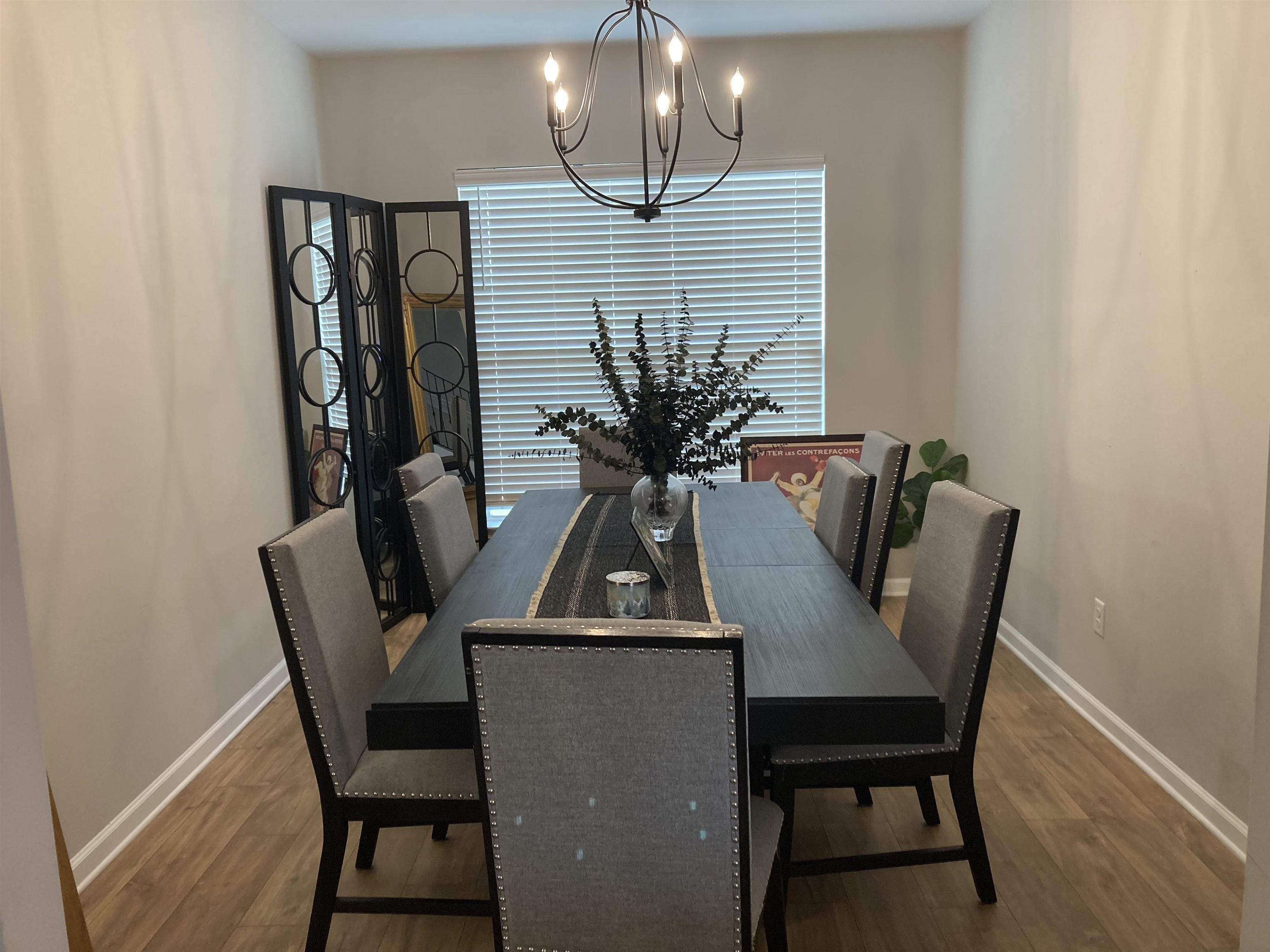 7828 Shadowcrest Road Memphis, TN 38125 - Photo 3 of 13 a view of a dining room with furniture and wooden floor