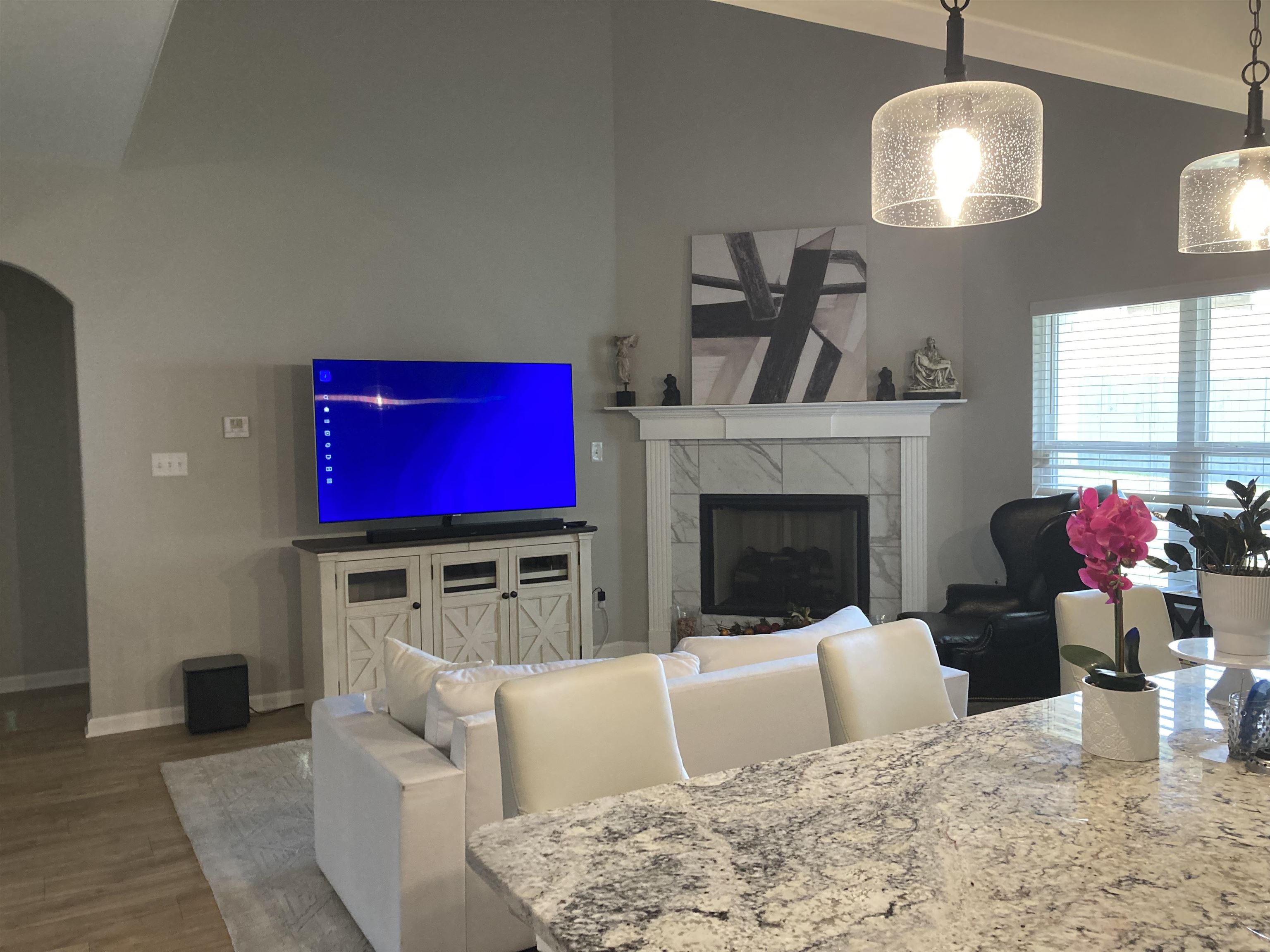 7828 Shadowcrest Road Memphis, TN 38125 - Photo 8 of 13 a living room with furniture and a fireplace