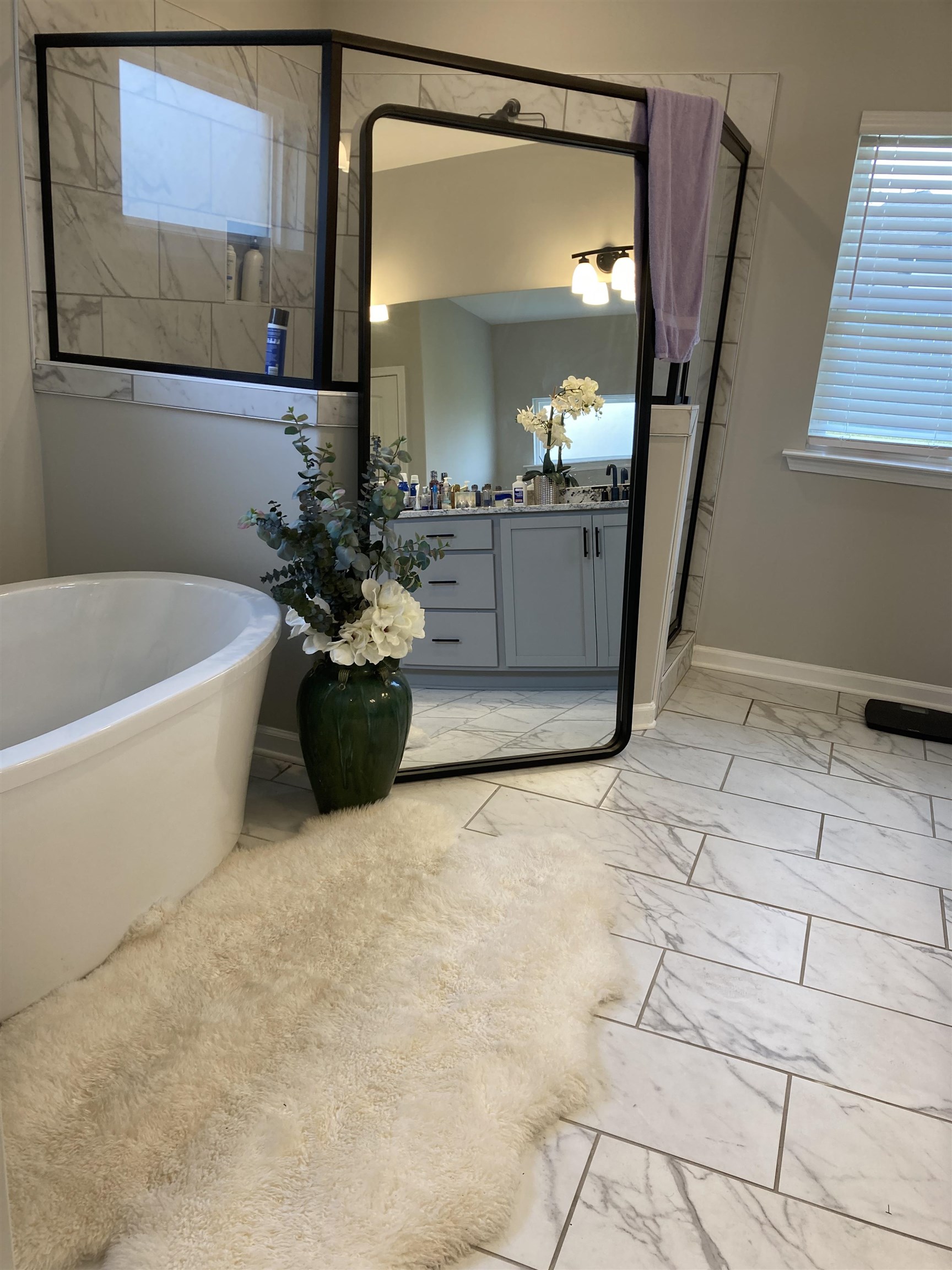 7828 Shadowcrest Road Memphis, TN 38125 - Photo 9 of 13 a white bath tub sitting in a bathroom