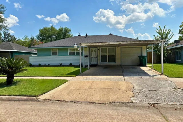 a view of a house with a garden