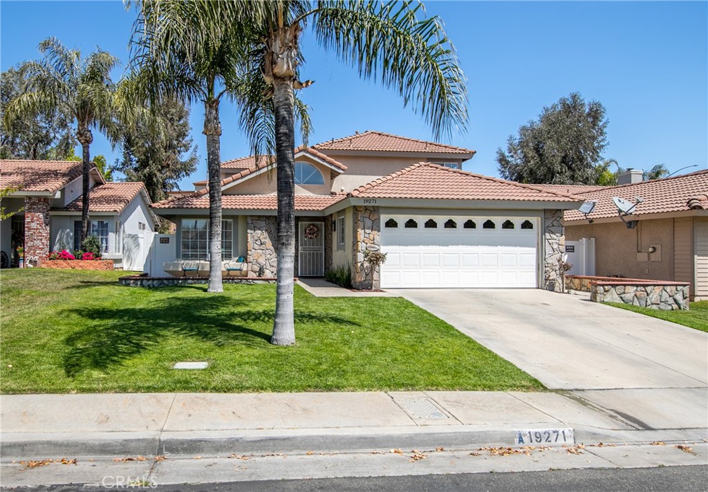19271 Foxtail Lane Riverside, CA 92508 - Photo 1 of 1 a front view of a house with garden