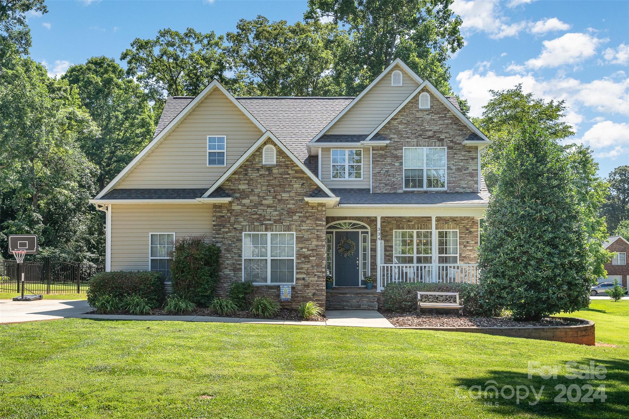 334 Adrian Road Salisbury, NC 28146 - Photo 1 of 40 a front view of a house with a yard and garage