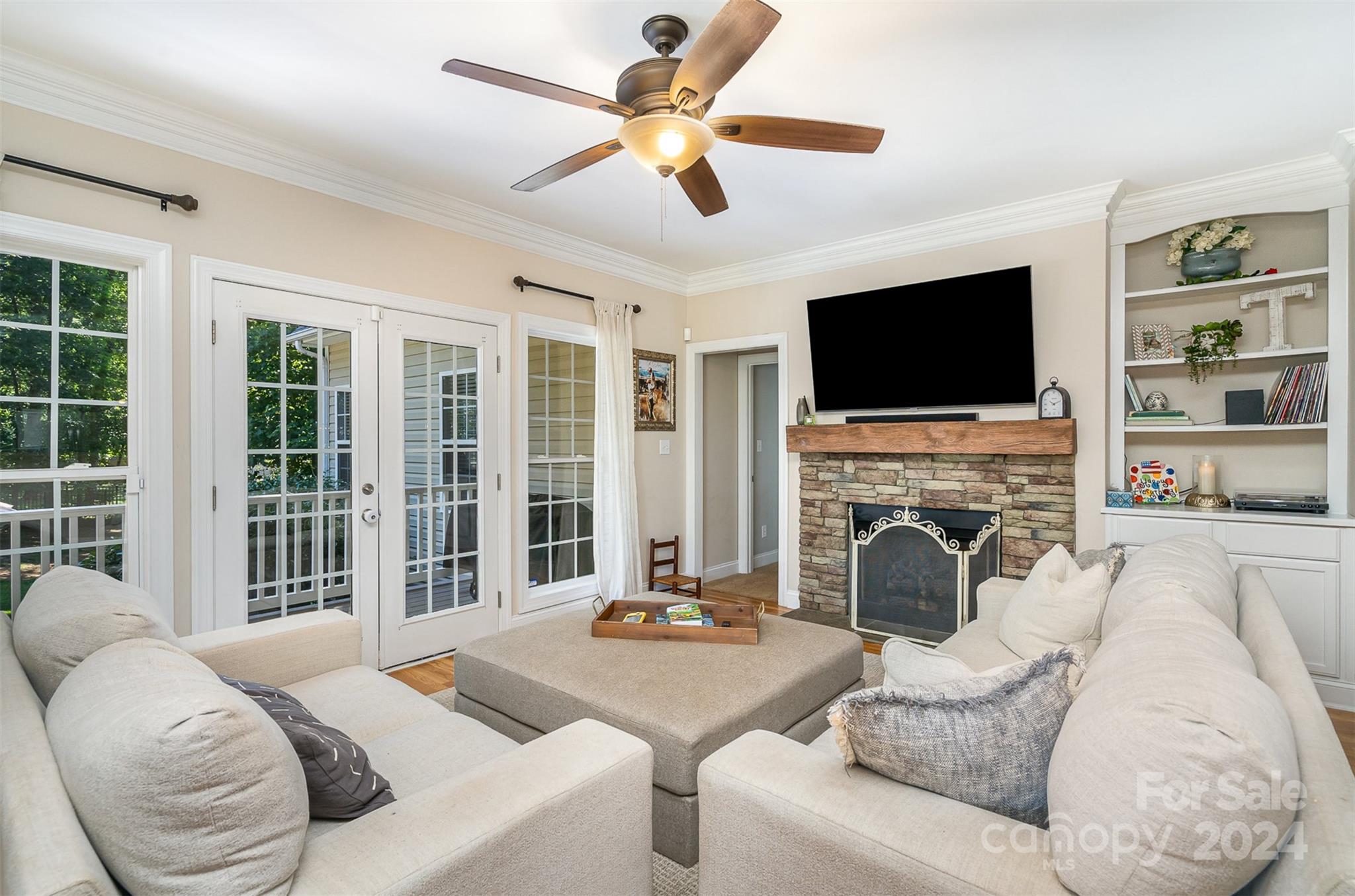 334 Adrian Road Salisbury, NC 28146 - Photo 11 of 40 a living room with furniture a fireplace and a flat screen tv