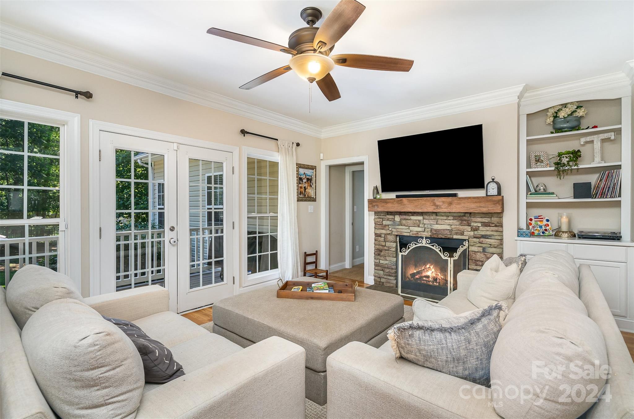 334 Adrian Road Salisbury, NC 28146 - Photo 12 of 40 a living room with furniture a fireplace and a flat screen tv