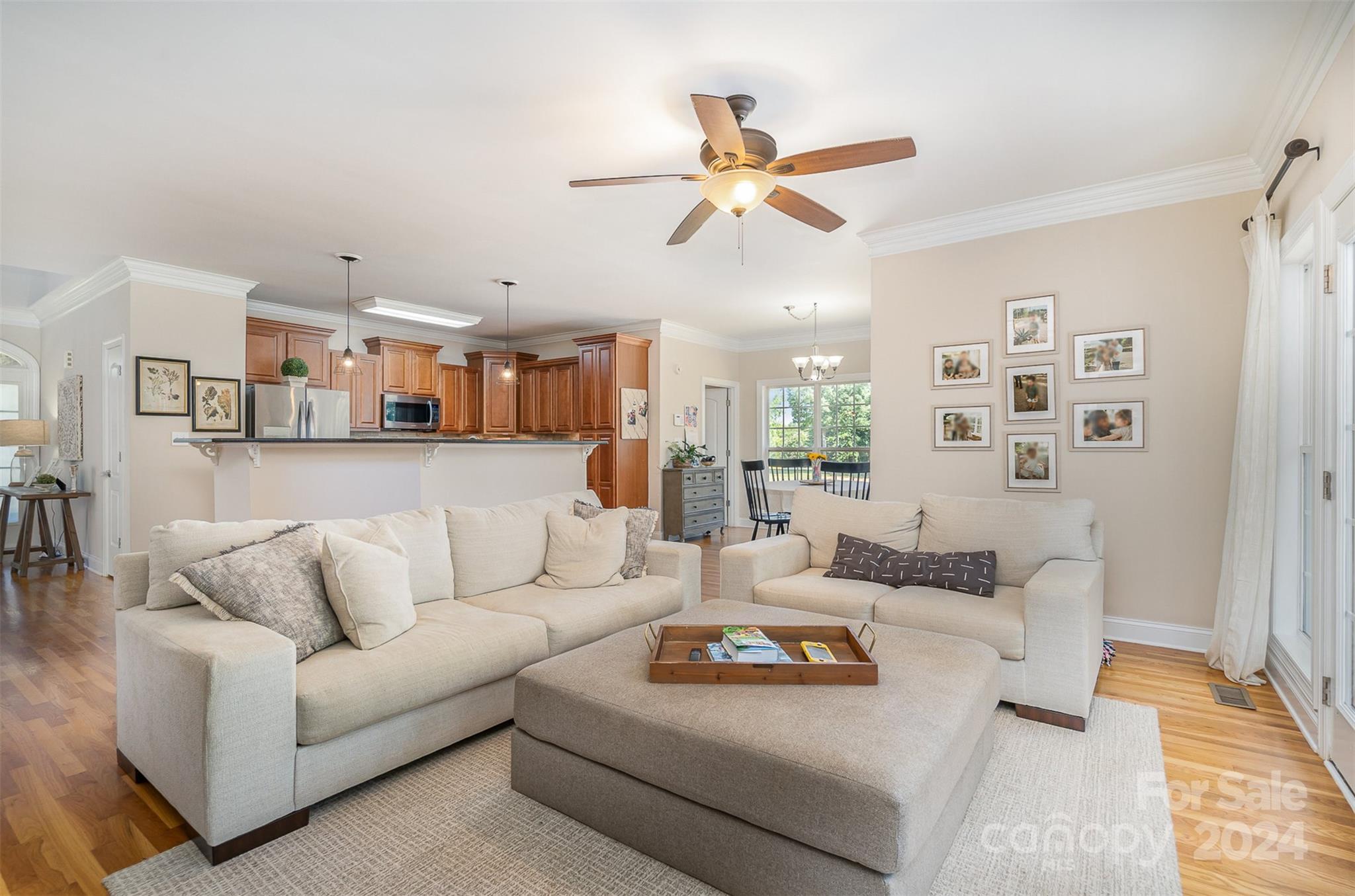 334 Adrian Road Salisbury, NC 28146 - Photo 13 of 40 a living room with furniture kitchen and a chandelier