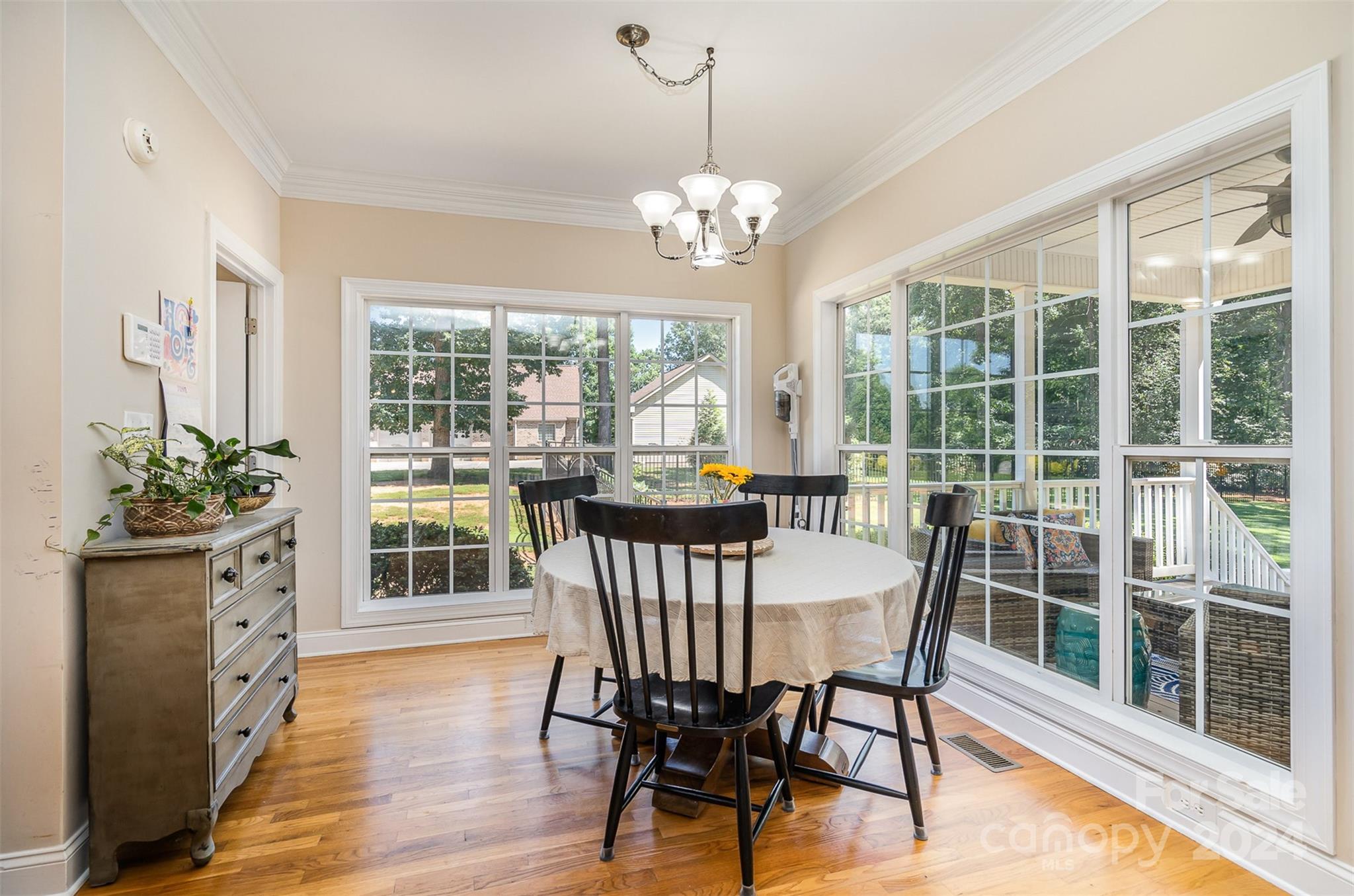 334 Adrian Road Salisbury, NC 28146 - Photo 16 of 40 a view of a dining room with furniture large windows and wooden floor