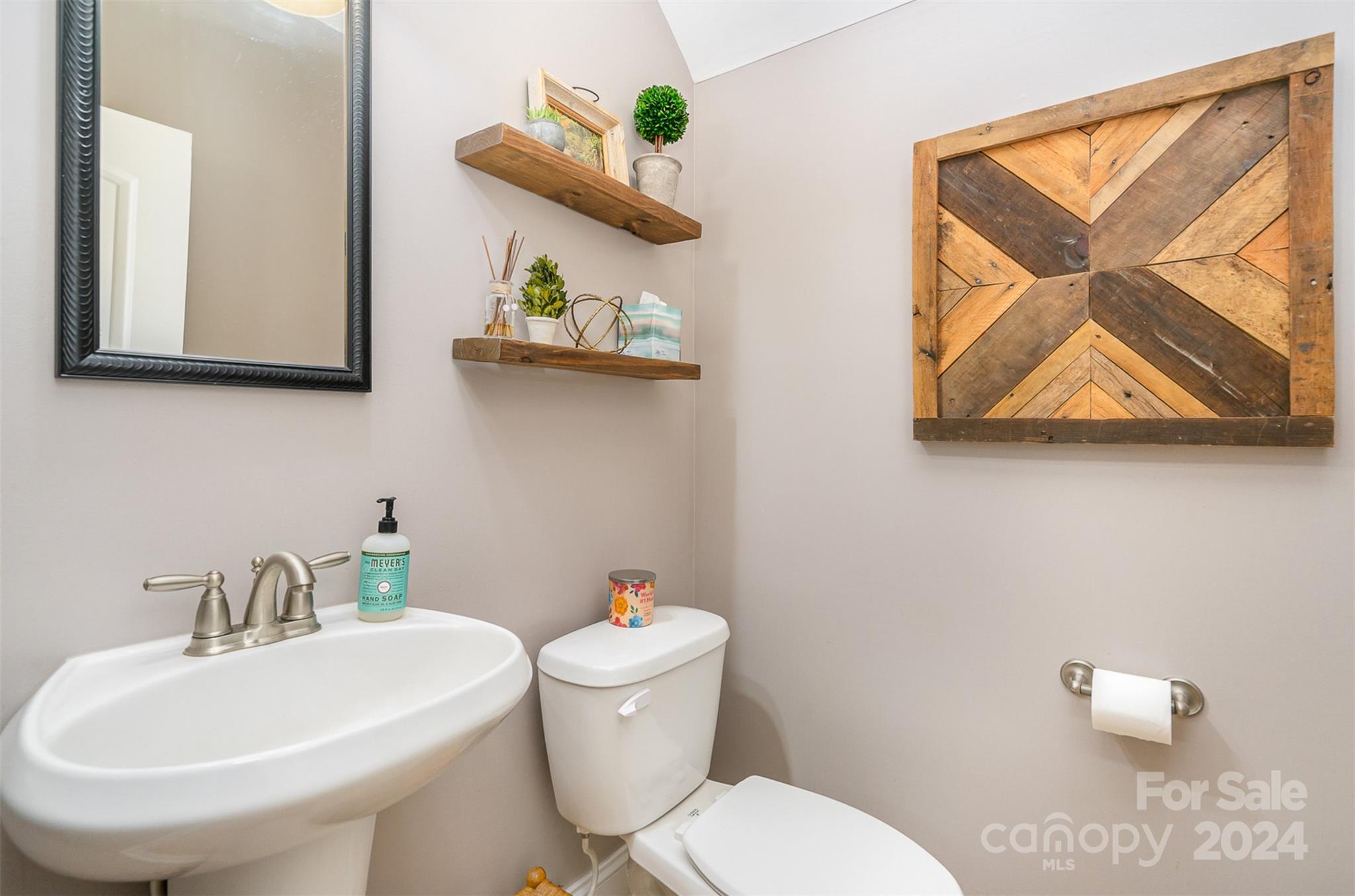 334 Adrian Road Salisbury, NC 28146 - Photo 17 of 40 a bathroom with a toilet sink and mirror