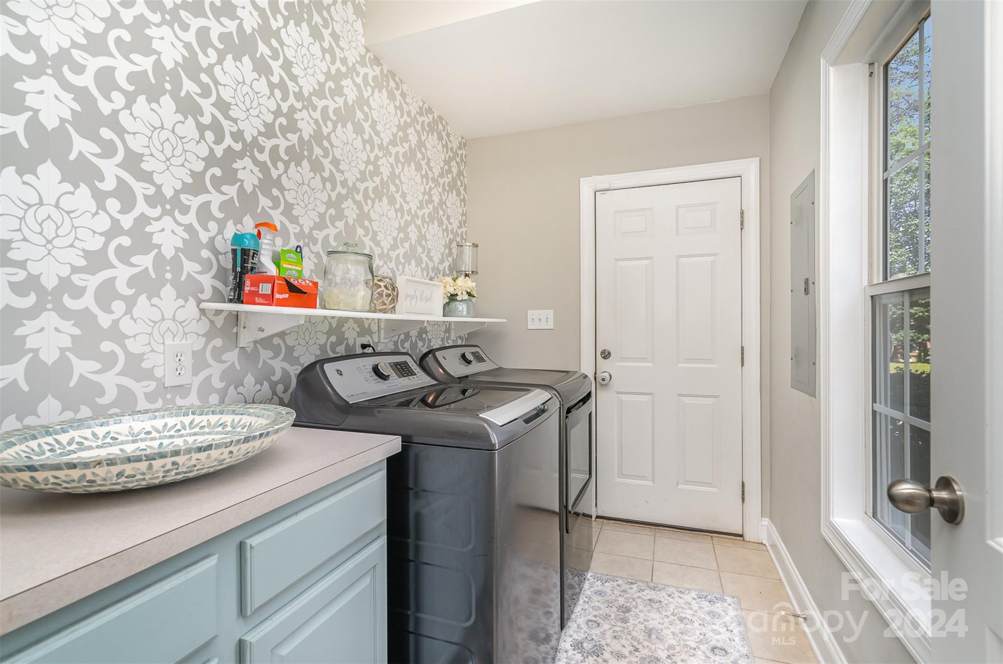 334 Adrian Road Salisbury, NC 28146 - Photo 18 of 40 a utility room with sink dryer and washer