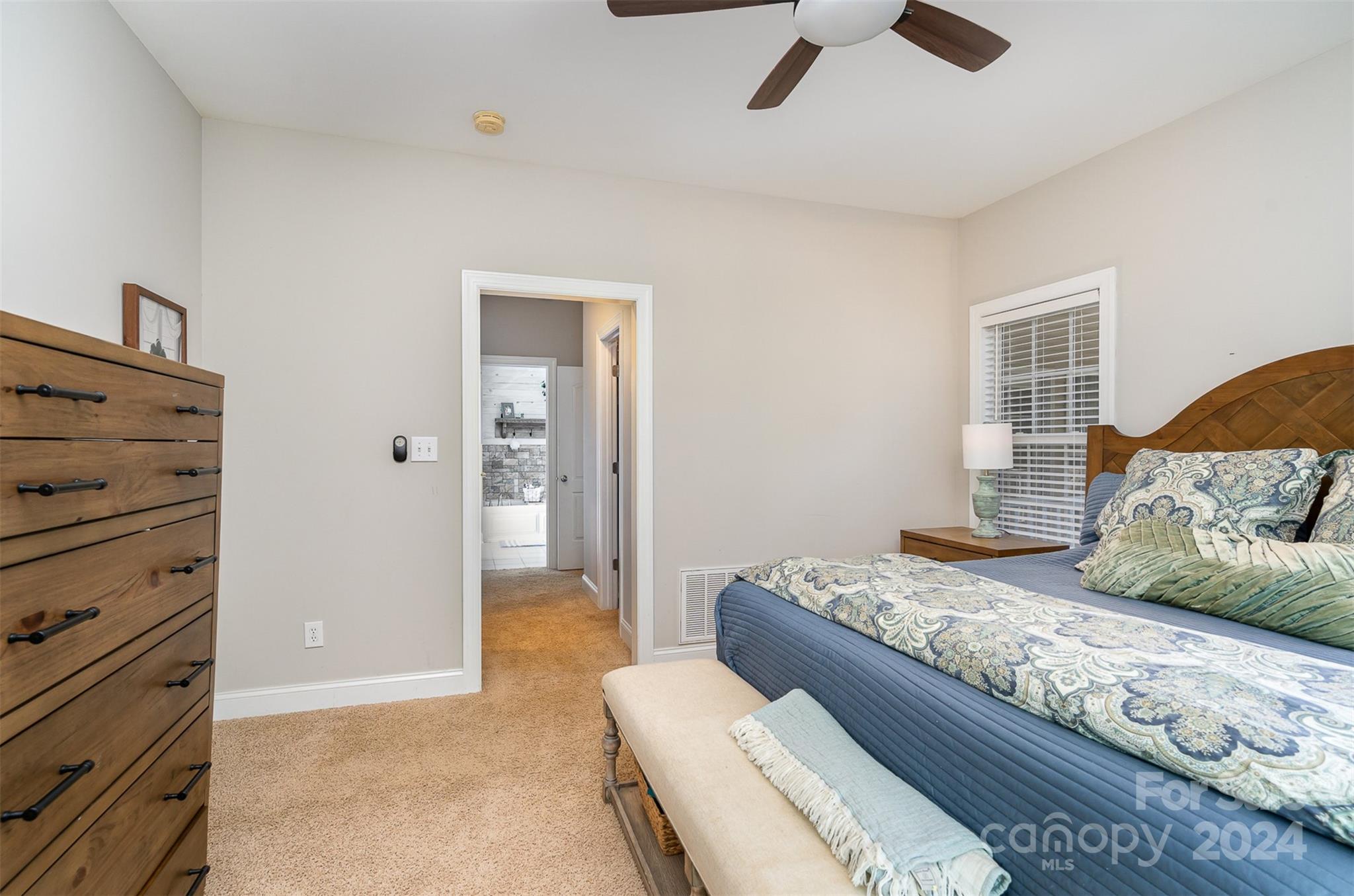 334 Adrian Road Salisbury, NC 28146 - Photo 20 of 40 a bedroom with a bed and a ceiling fan