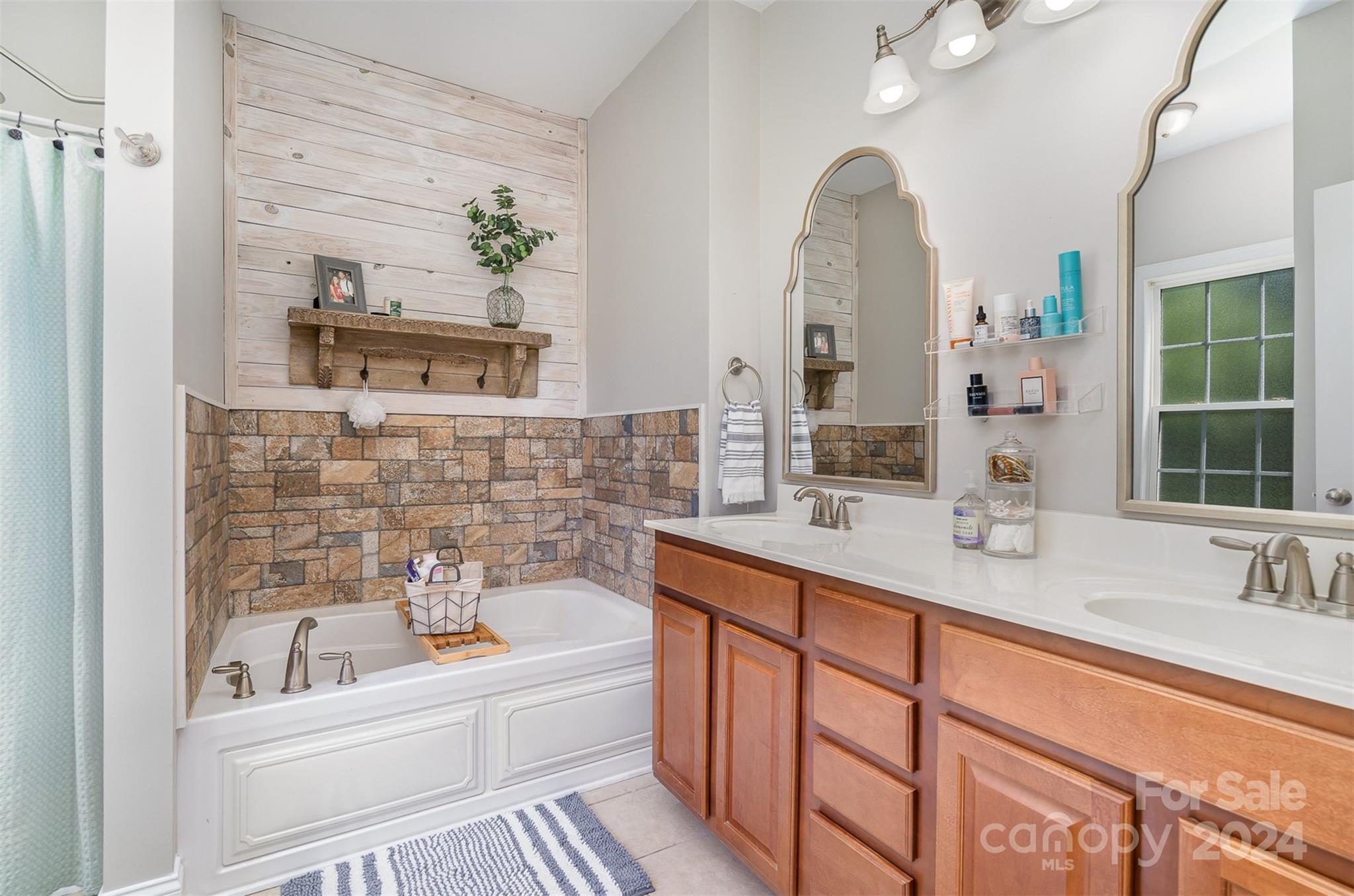 334 Adrian Road Salisbury, NC 28146 - Photo 21 of 40 a bathroom with a tub sink and mirror