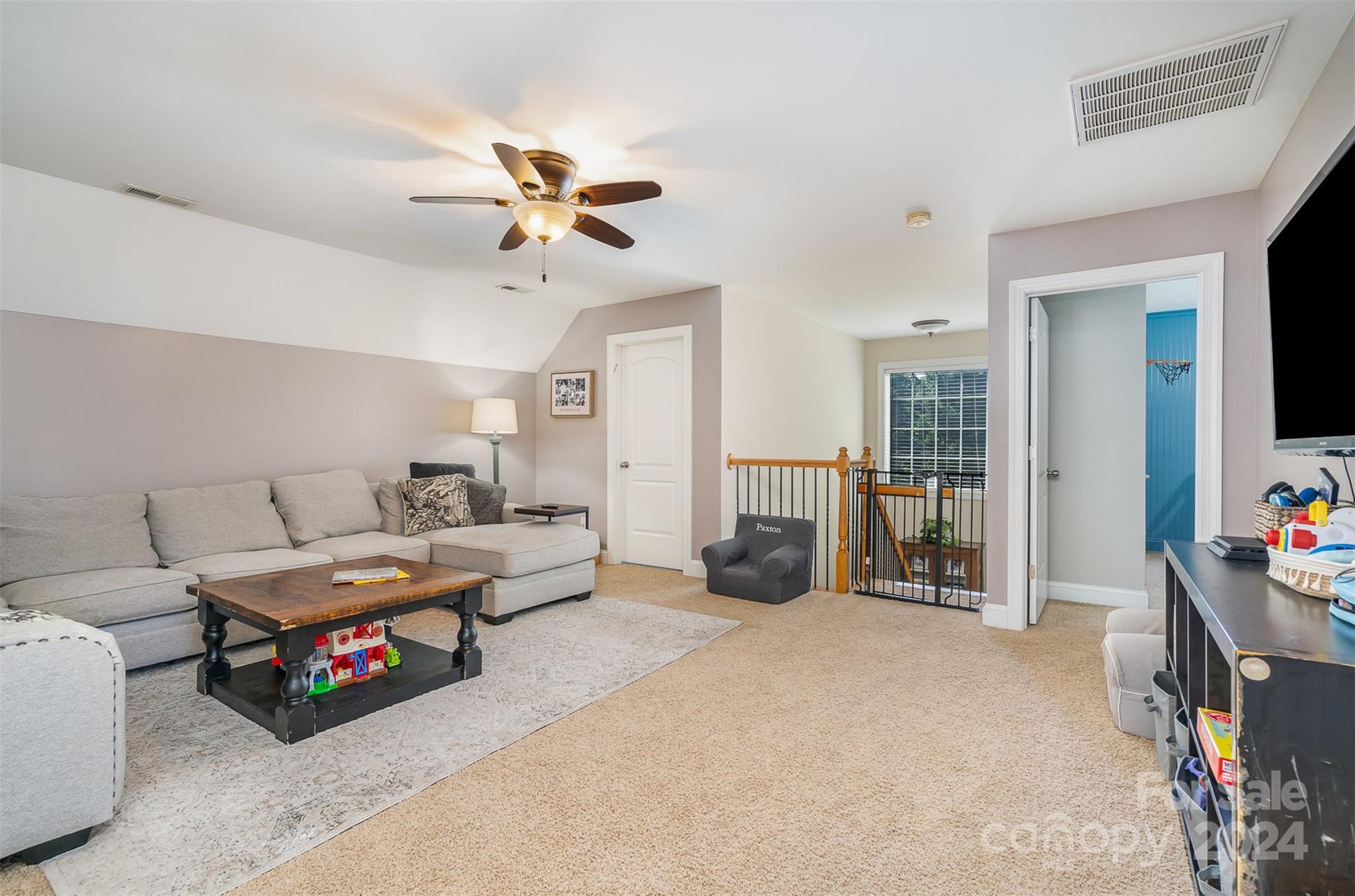 334 Adrian Road Salisbury, NC 28146 - Photo 22 of 40 a living room with furniture and a flat screen tv