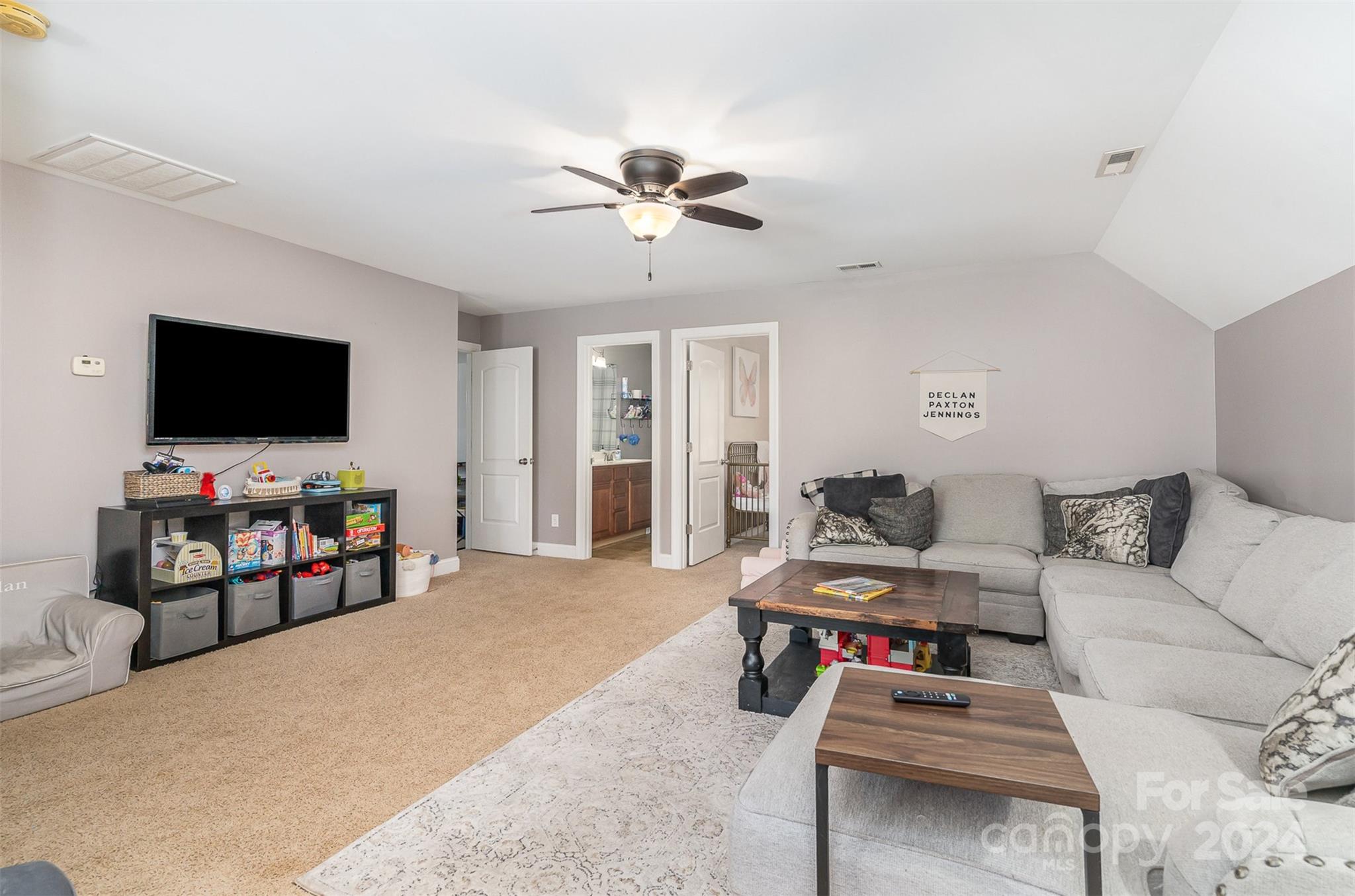 334 Adrian Road Salisbury, NC 28146 - Photo 23 of 40 a living room with furniture and a flat screen tv