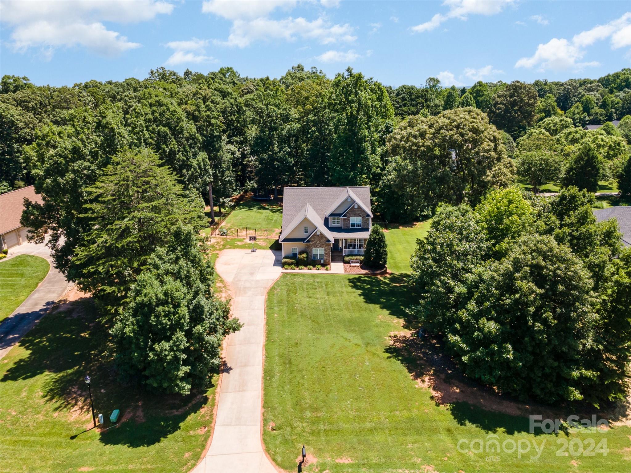 334 Adrian Road Salisbury, NC 28146 - Photo 3 of 40 a view of a house with a yard and garden